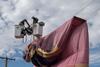PNM workers remove a hot air balloon from power lines during a safety demonstration in Mexico