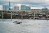 A boat on a river with the view of the City of Portland, Oregon