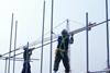 development construction workers on scaffolding rs