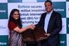 Sumant Sinha, Founder, Chairman & CEO of ReNew, and Shilpa Kumar, MD and Head of India at British International Investment (BII), formalize a landmark $100 million investment ag