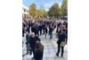 Delegates thronged the outdoor spaces between the halls, enjoying the sunshine