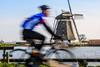 cyclist blurred windmillrs