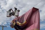 PNM workers remove a hot air balloon from power lines during a safety demonstration in Mexico
