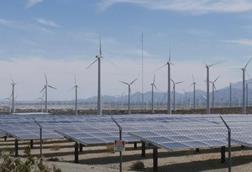 Wind turbines and solar panels on the countryside