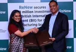 Sumant Sinha, Founder, Chairman & CEO of ReNew, and Shilpa Kumar, MD and Head of India at British International Investment (BII), formalize a landmark $100 million investment ag