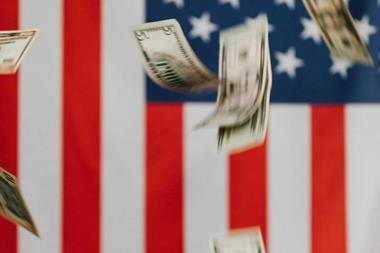 American flag and money falling down
