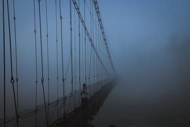 Suspension bridge in the mist
