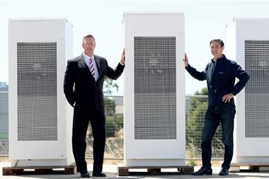 Australian energy minister Dan van Holst Pellekaan (left) and Neoen Australia managing director Louis de Sambucy pose with the world’s largest battery