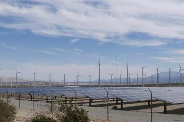 Wind turbines and solar panels on the countryside
