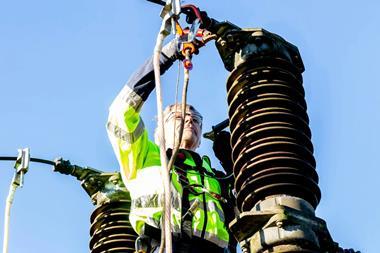 Man working on a power cable credit Pexels
