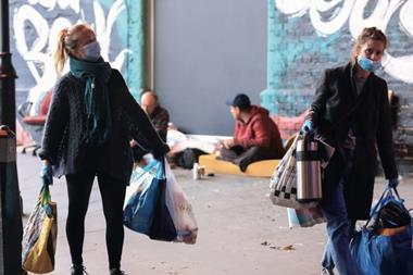 Volunteers help the homeless in London