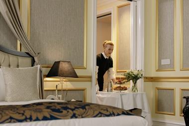 Woman serving order from a hotel room service