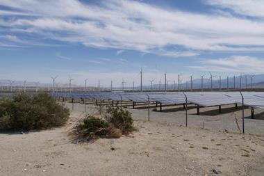Wind turbines and solar panels on the countryside