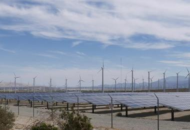 Wind turbines and solar panels on the countryside