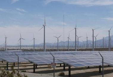 Wind turbines and solar panels on the countryside
