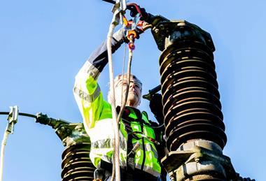 Man working on a power cable credit Pexels