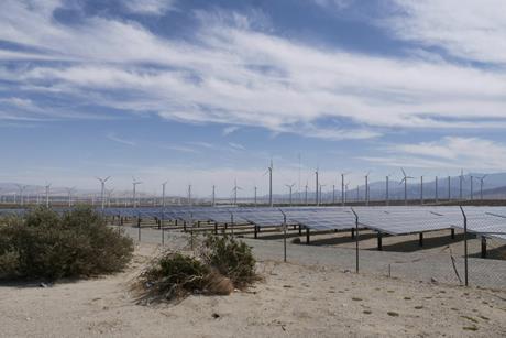 Wind turbines and solar panels on the countryside