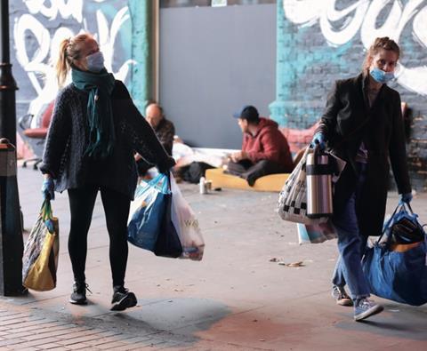 Volunteers help the homeless in London