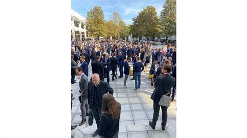 Delegates thronged the outdoor spaces between the halls, enjoying the sunshine