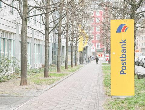 postbank munich sign infront bank copy space to left 62459978