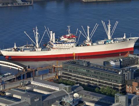 the office has a view of the cap san diego museum ship in hamburg port